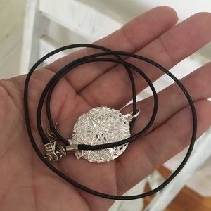 SILVER plated hollow locket with black cord